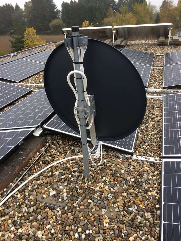 Satellite dish mounting beside solar panels